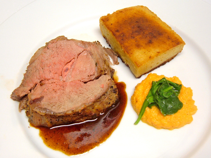 Saddle of Lamb, Plated with Millet Bread, Carrot Puree, and Spinach Saddle of Lamb, Plated with Millet Bread, Carrot Puree, and Spinach