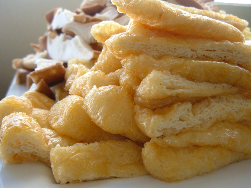Sukiyaki: Aburaage, or Fried Tofu Pouches, Sliced into Strips Sukiyaki: Aburaage, or Fried Tofu Pouches, Sliced into Strips